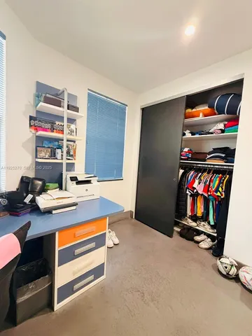a view of a hallway with front door