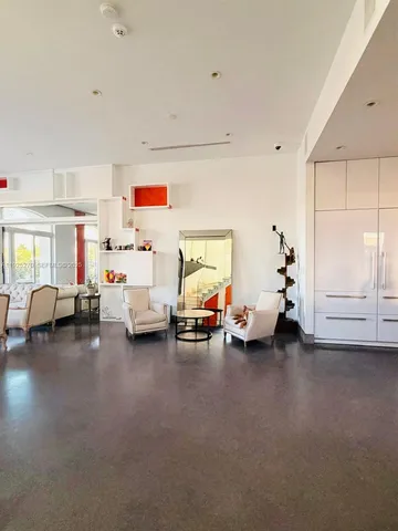 a children room with furniture and a window