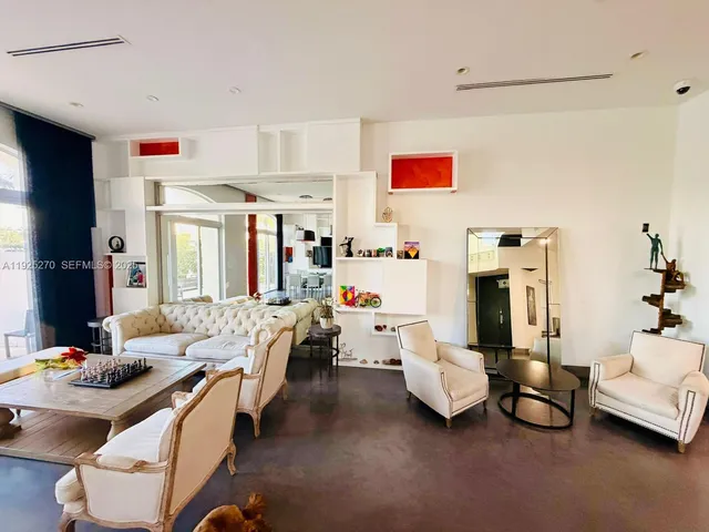 a room with furniture and a chandelier