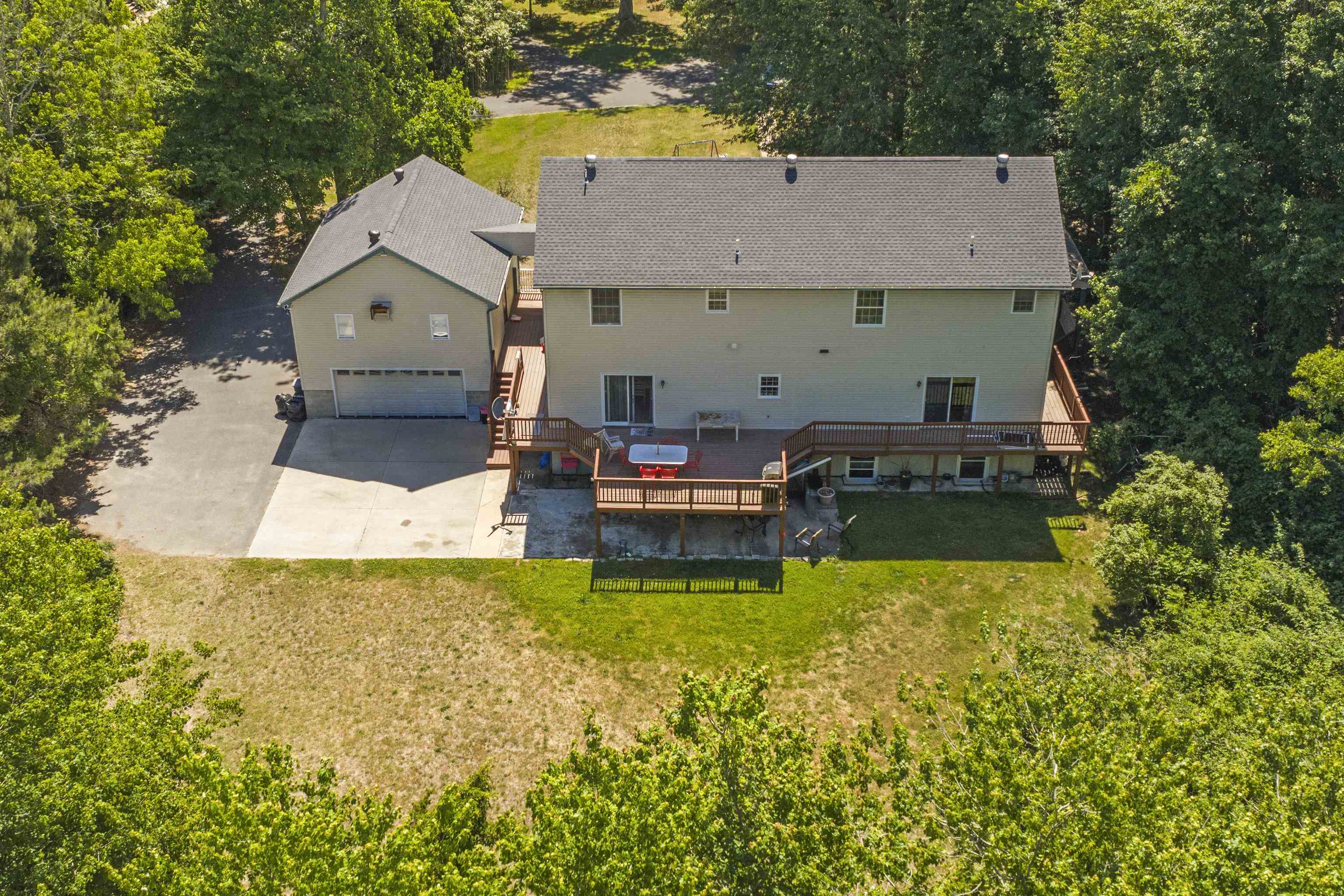 551 Shunpike Road Cape May Court House, NJ 08210 - Photo 40 of 47 a aerial view of a house with swimming pool and a yard