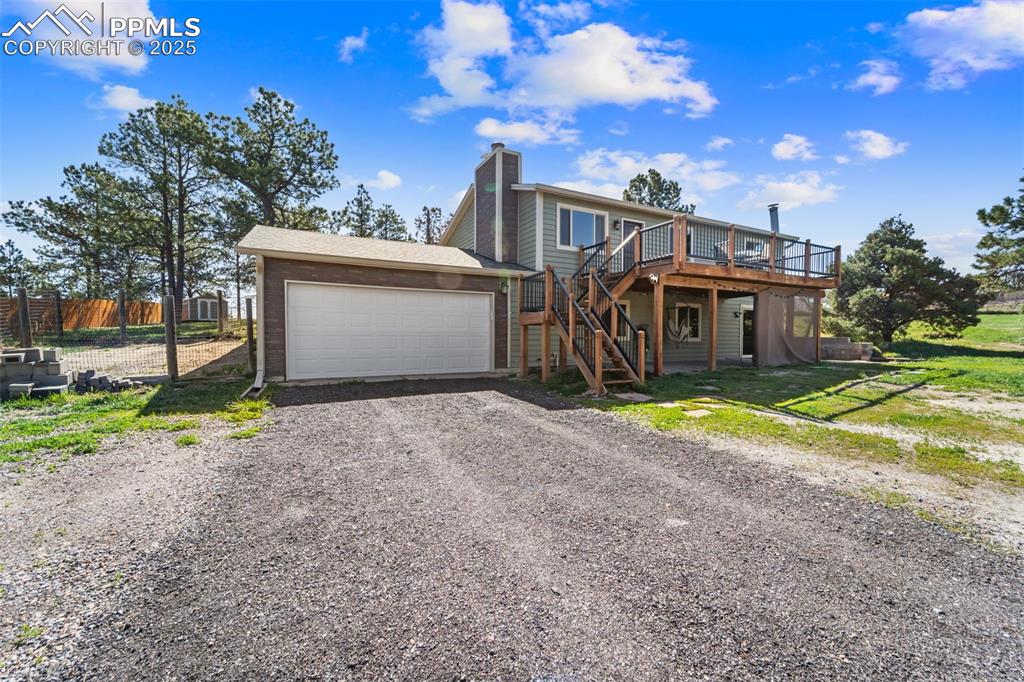 1151 Buttercup Road Elizabeth, CO 80107 - Photo 16 of 45 a view of a house with pool and a yard