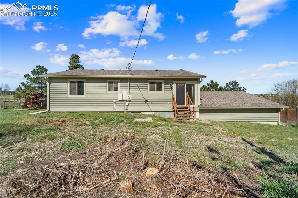 1151 Buttercup Road Elizabeth, CO 80107 - Photo 19 of 45 a front view of a house with garden