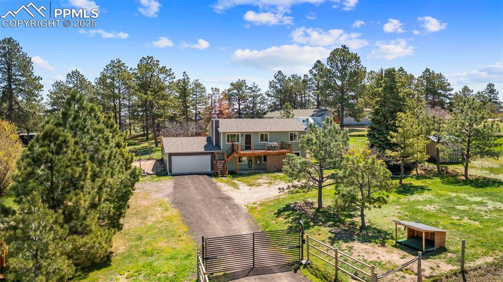 1151 Buttercup Road Elizabeth, CO 80107 - Photo 2 of 45 a view of a house with a yard