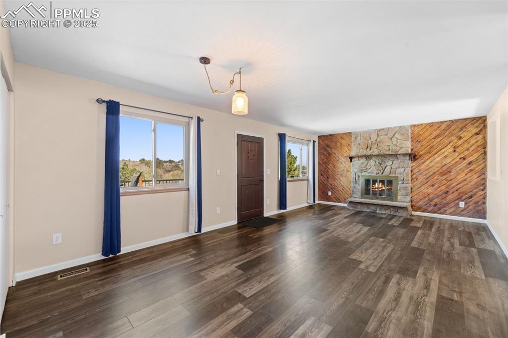 1151 Buttercup Road Elizabeth, CO 80107 - Photo 26 of 45 a view of a room with wooden floor and window