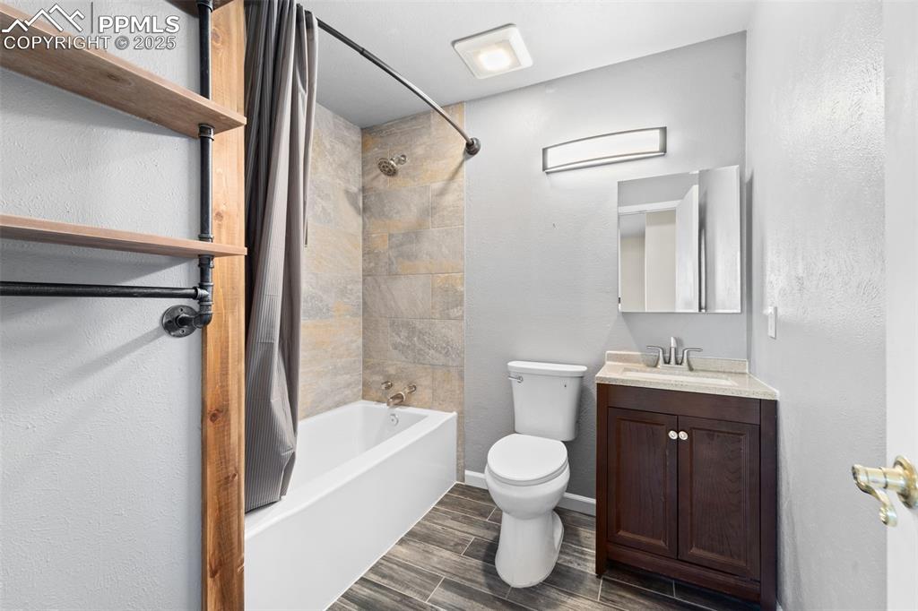 1151 Buttercup Road Elizabeth, CO 80107 - Photo 27 of 45 a bathroom with a sink toilet and shower