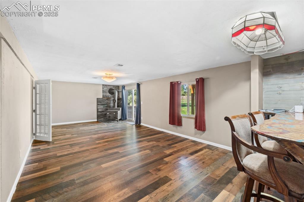 1151 Buttercup Road Elizabeth, CO 80107 - Photo 37 of 45 a very nice looking room with wooden floor