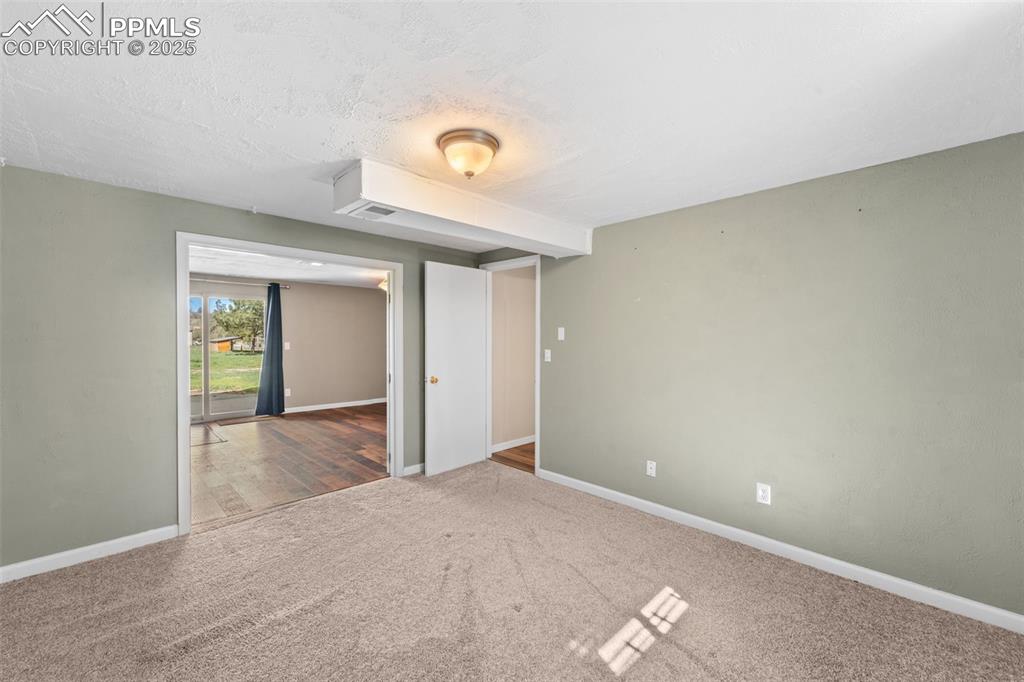 1151 Buttercup Road Elizabeth, CO 80107 - Photo 43 of 45 a view of a livingroom with a dishwasher and dresser