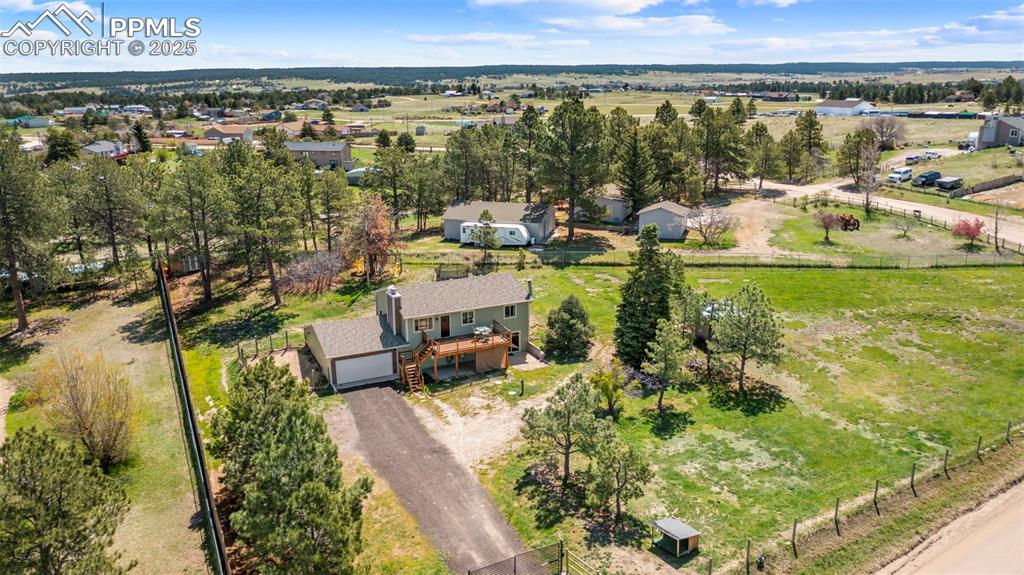 1151 Buttercup Road Elizabeth, CO 80107 - Photo 9 of 45 a view of a swimming pool and an outdoor seating