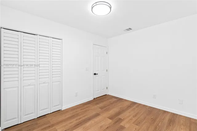 a view of a livingroom with wooden floor
