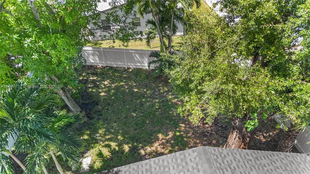 a view of a house with a tree