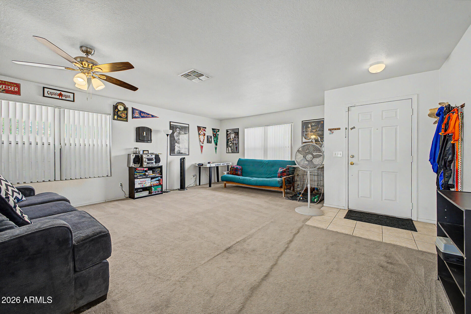 2607 West Bloch Road Phoenix, AZ 85041 - Photo 4 of 34 a living room with furniture and a flat screen tv