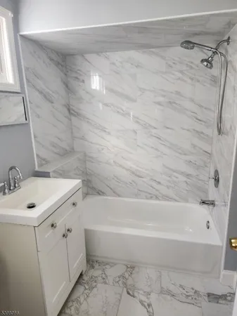 a bathroom with a sink and a bathtub