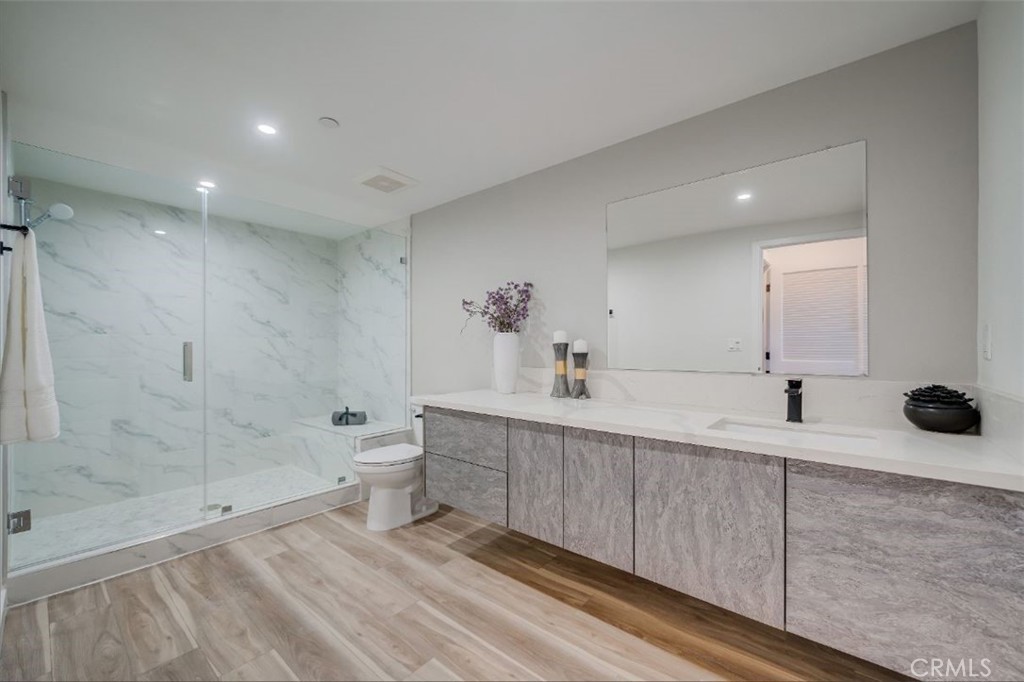 7018 Alabama Avenue, Unit 201 Canoga Park, CA 91303 - Photo 13 of 25 a spacious bathroom with a bathtub shower sink mirror and toilet