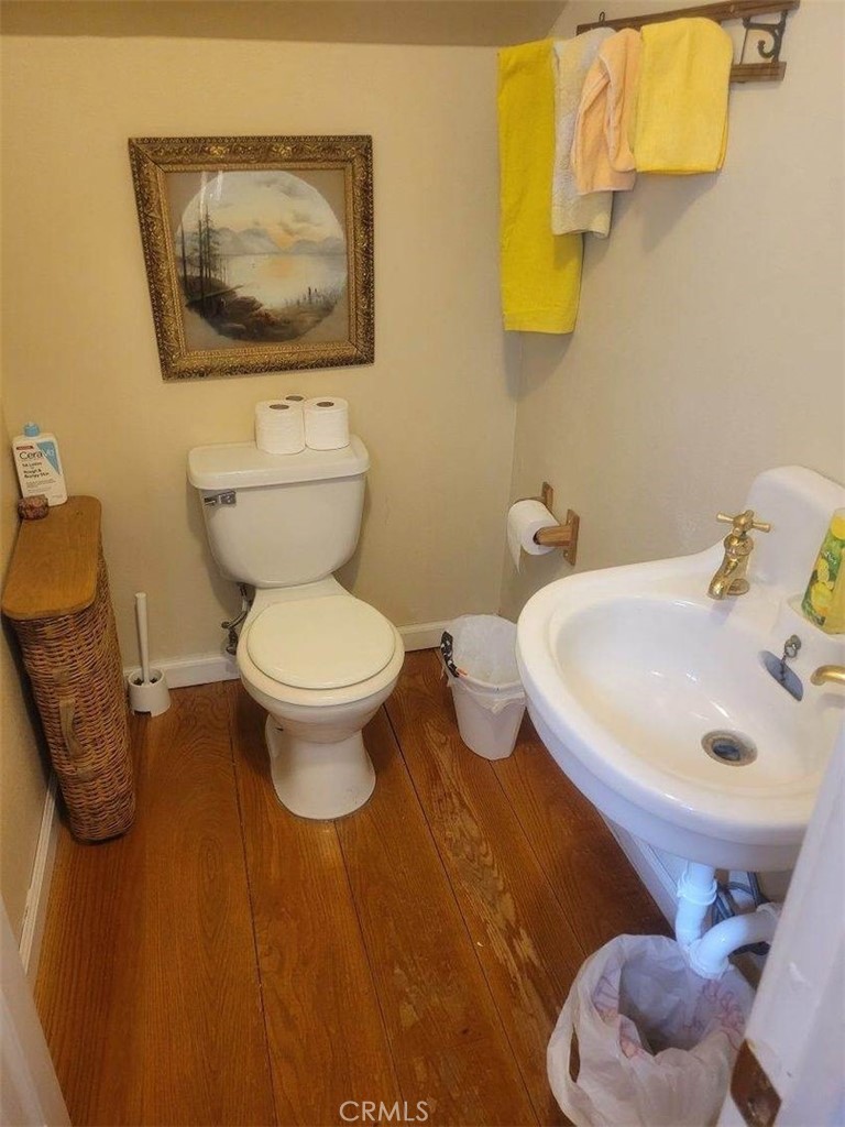 29591 Hook Creek Road Cedar Glen, CA 92321 - Photo 11 of 14 a bathroom with a toilet sink and mirror