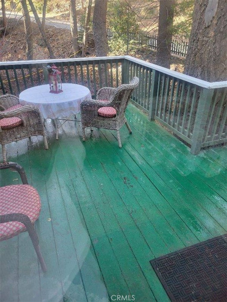 29591 Hook Creek Road Cedar Glen, CA 92321 - Photo 12 of 14 a view of a deck with wooden floor and seating space