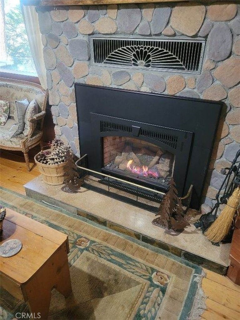29591 Hook Creek Road Cedar Glen, CA 92321 - Photo 3 of 14 a stove top oven sitting inside of a kitchen