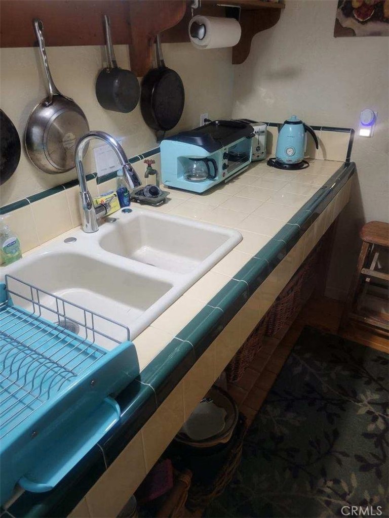 29591 Hook Creek Road Cedar Glen, CA 92321 - Photo 5 of 14 a kitchen with a sink and a stove