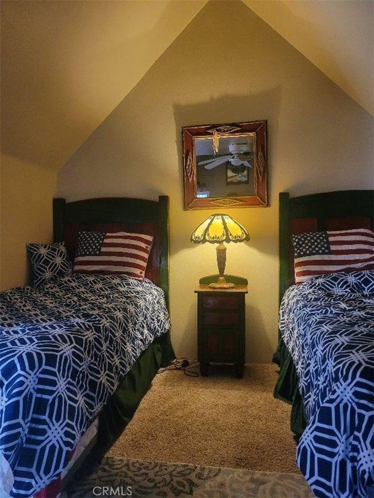 29591 Hook Creek Road Cedar Glen, CA 92321 - Photo 8 of 14 a bedroom with a bed and a dresser