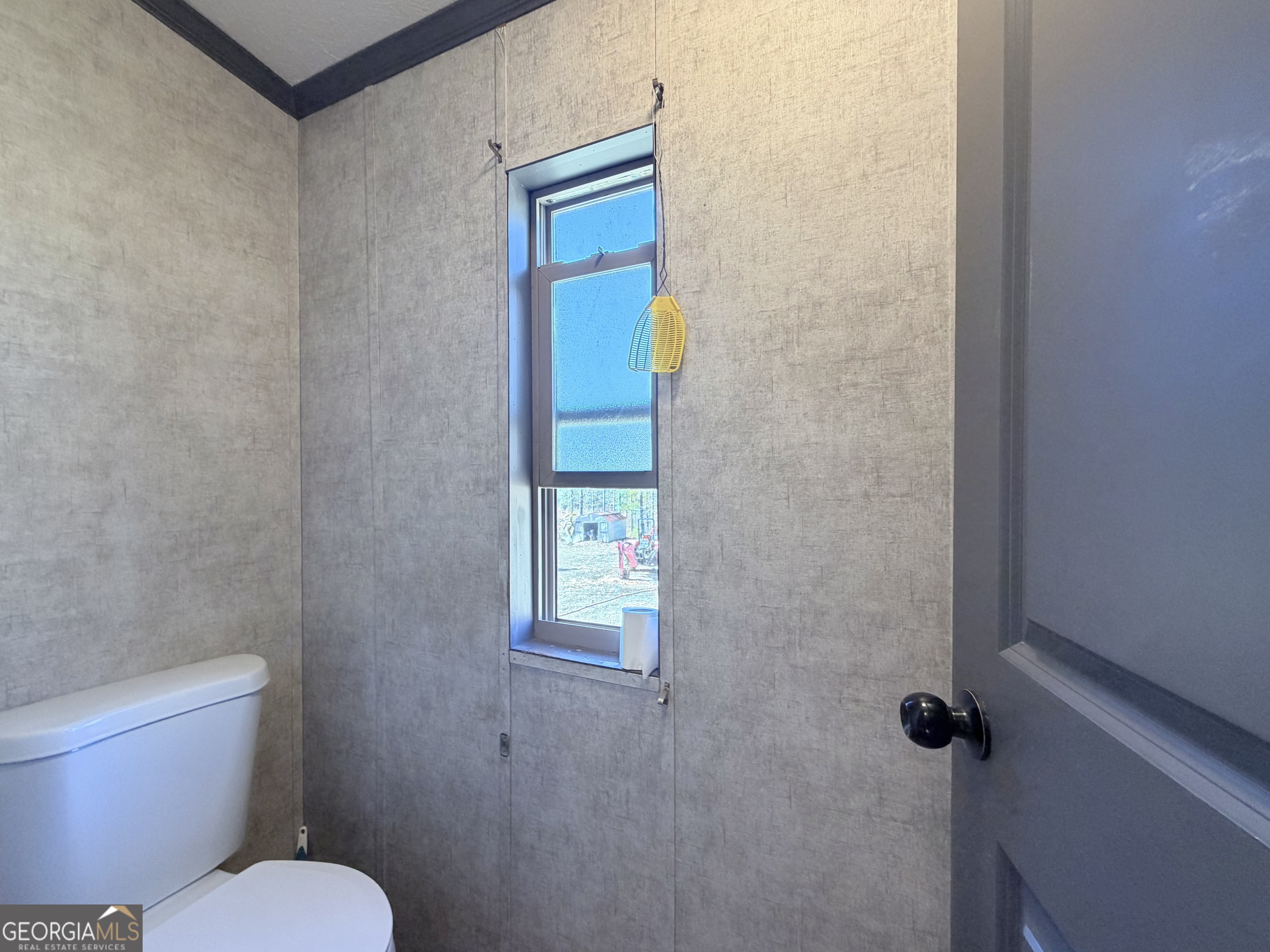 195 Margarets Grove Road Crawfordville, GA 30631 - Photo 12 of 34 a bathroom with a toilet and a shower