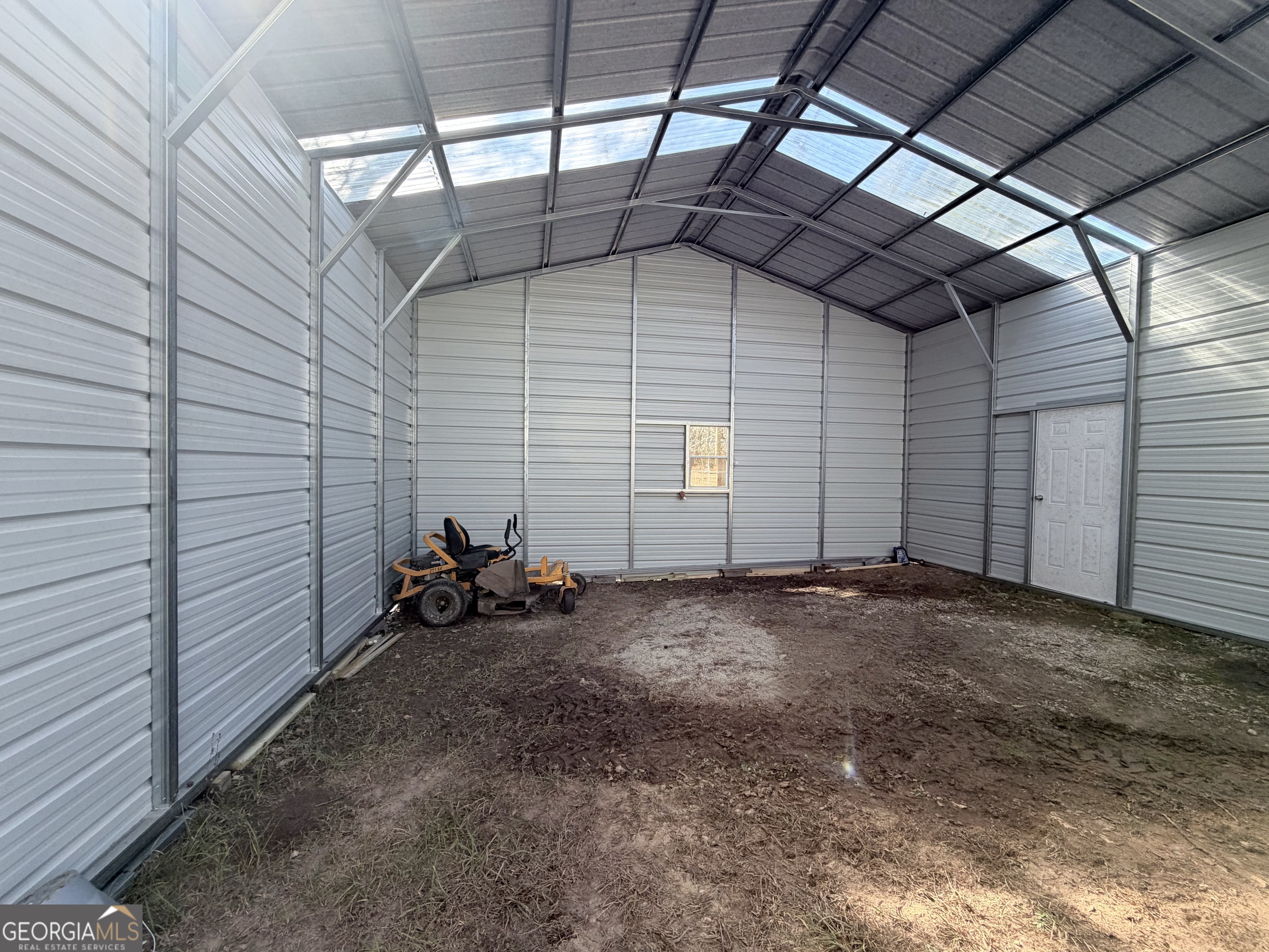 195 Margarets Grove Road Crawfordville, GA 30631 - Photo 17 of 34 a view of a room with lots of windows