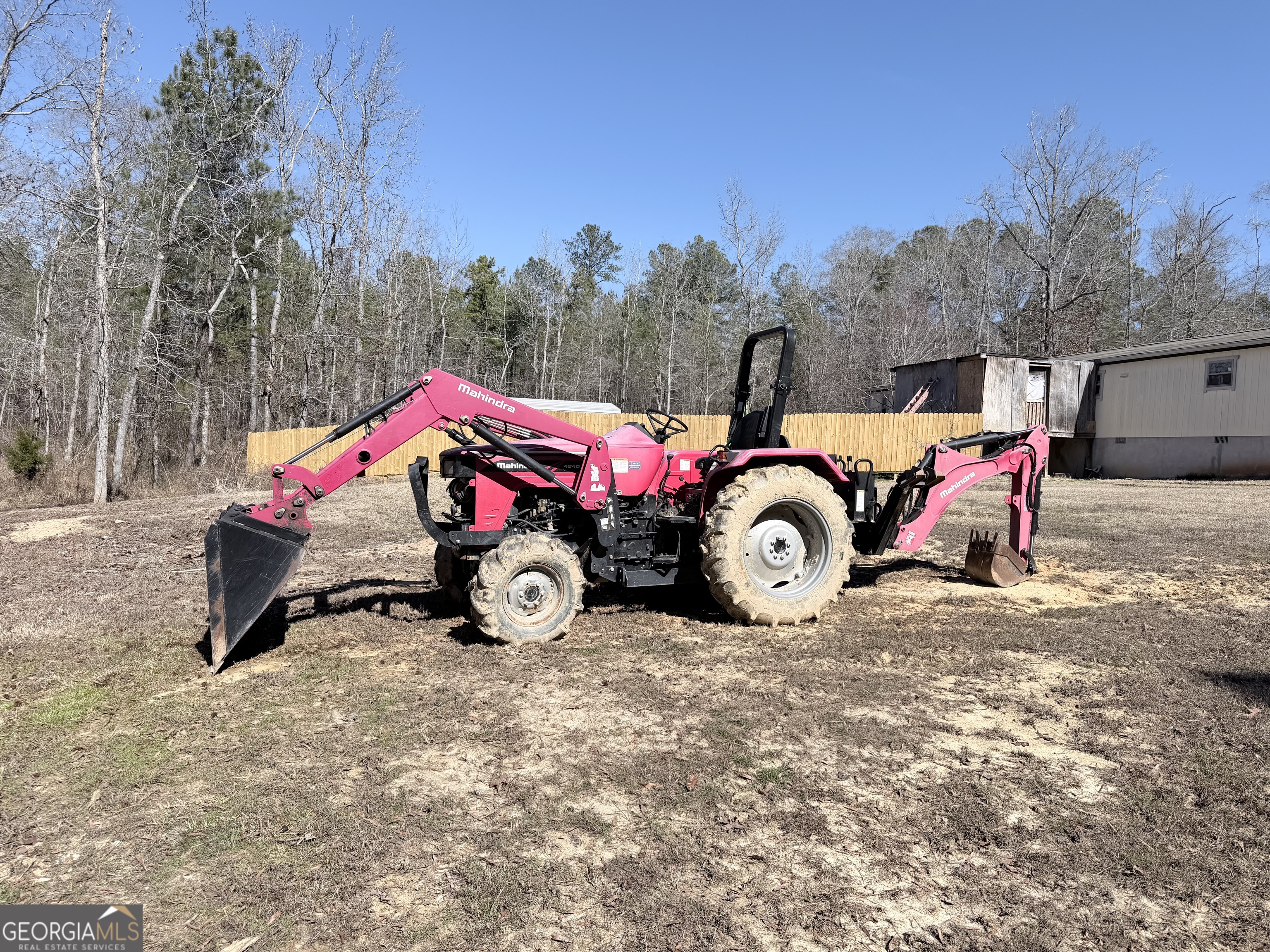 195 Margarets Grove Road Crawfordville, GA 30631 - Photo 18 of 34 a blue bench sitting in the middle of a yard