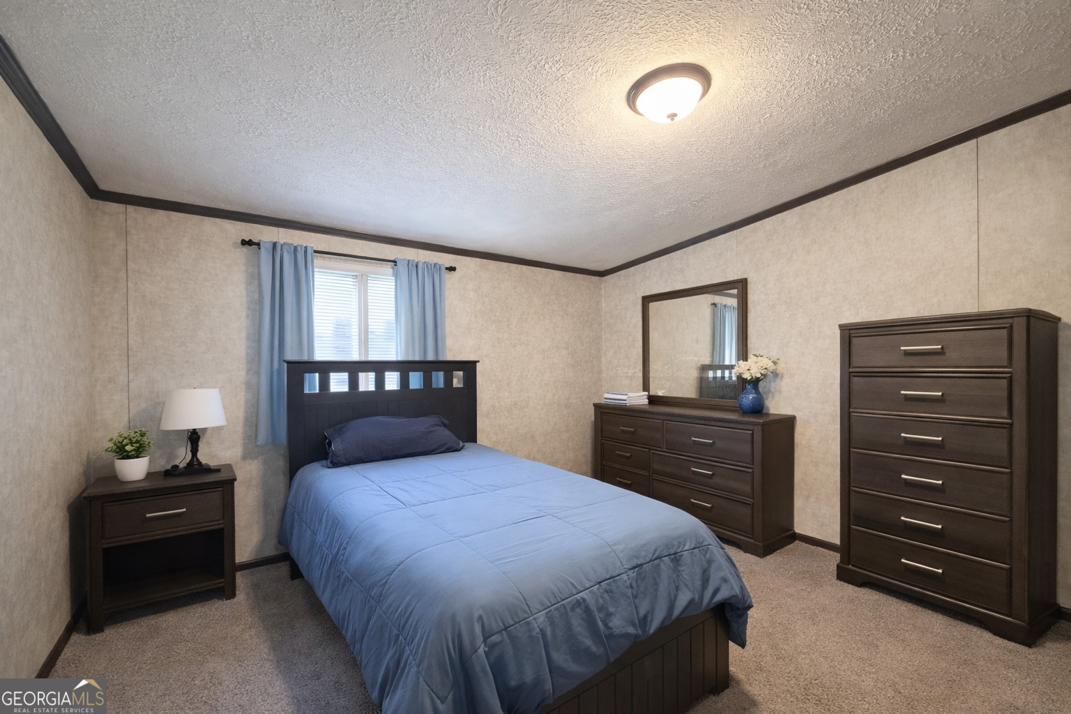 195 Margarets Grove Road Crawfordville, GA 30631 - Photo 6 of 34 a bedroom with a bed and a dresser