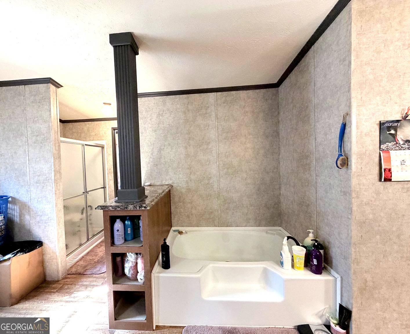 195 Margarets Grove Road Crawfordville, GA 30631 - Photo 10 of 34 a bath tub sitting in a bathroom next to a sink