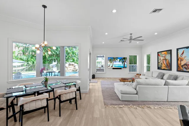 a view of a livingroom with workspace and a window