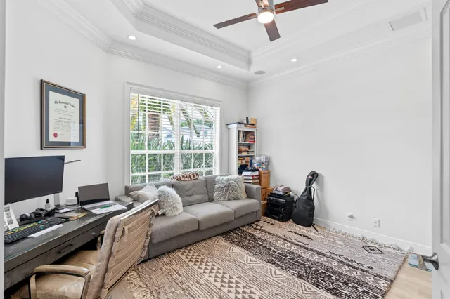a bathroom with a granite countertop sink a toilet a mirror and shower
