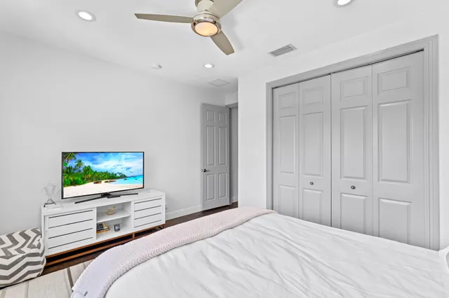a bathroom with a granite countertop sink a washer and dryer