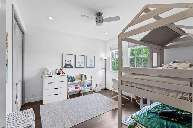 a view of a house with backyard sitting area and swimming pool