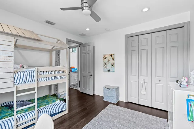 a view of a patio with a table and chairs under an umbrella