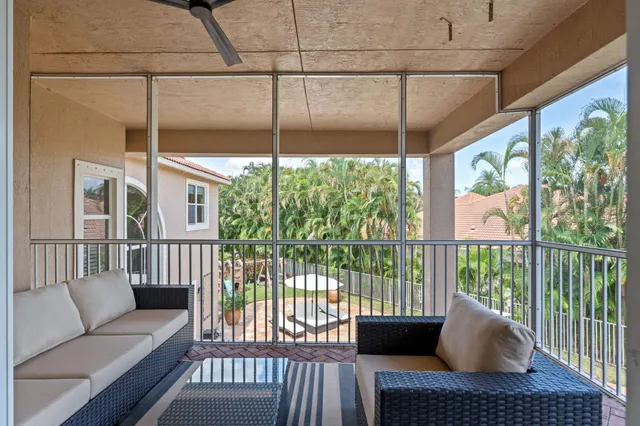 a view of yard with swimming pool and seating