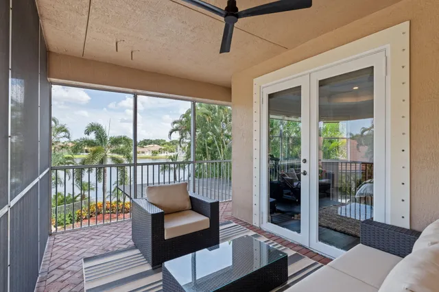 a view of a swimming pool with a sitting area