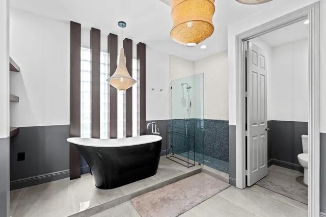 an aerial view of a house with a lake view