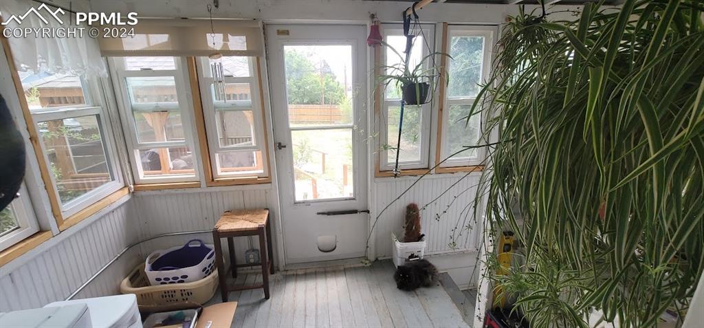 209 Indiana Avenue Walsenburg, CO 81089 - Photo 12 of 37 a living room with furniture and a potted plant