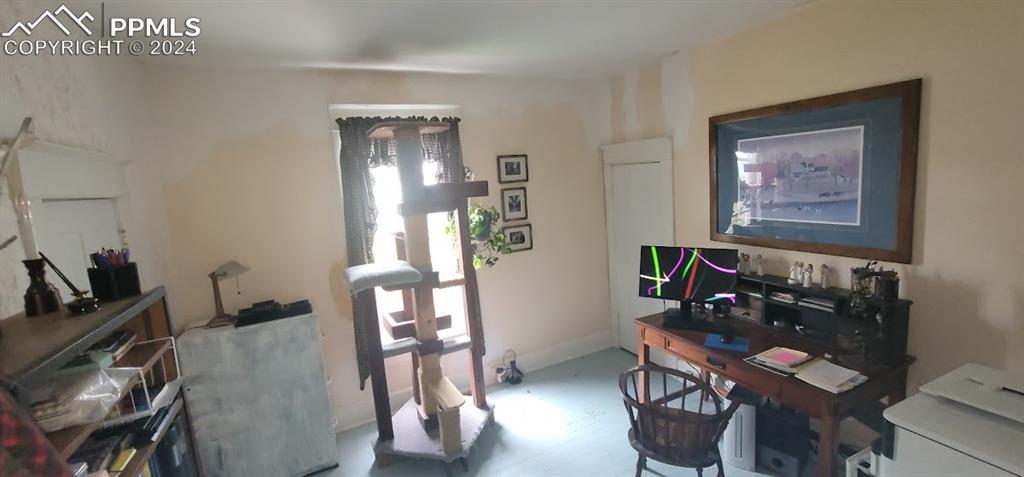 209 Indiana Avenue Walsenburg, CO 81089 - Photo 15 of 37 a living room with furniture and wooden floor
