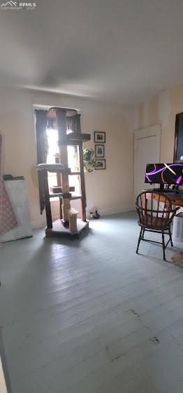 209 Indiana Avenue Walsenburg, CO 81089 - Photo 16 of 37 a living room with furniture and a lamp