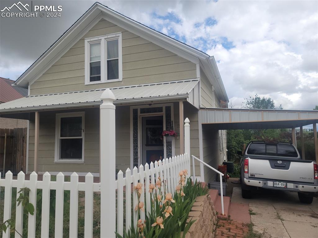 209 Indiana Avenue Walsenburg, CO 81089 - Photo 36 of 37 a front view of a house with a porch
