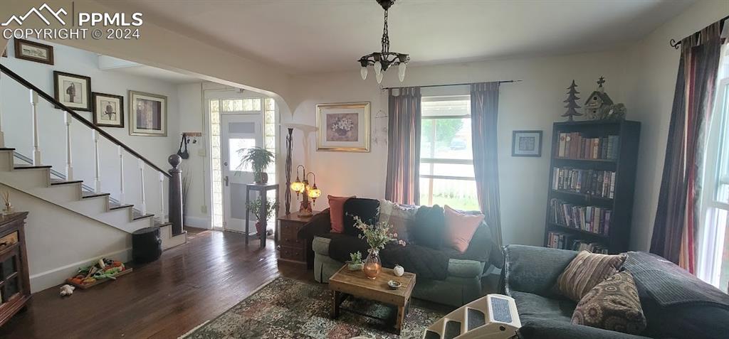 209 Indiana Avenue Walsenburg, CO 81089 - Photo 4 of 37 a living room with furniture and a book shelf
