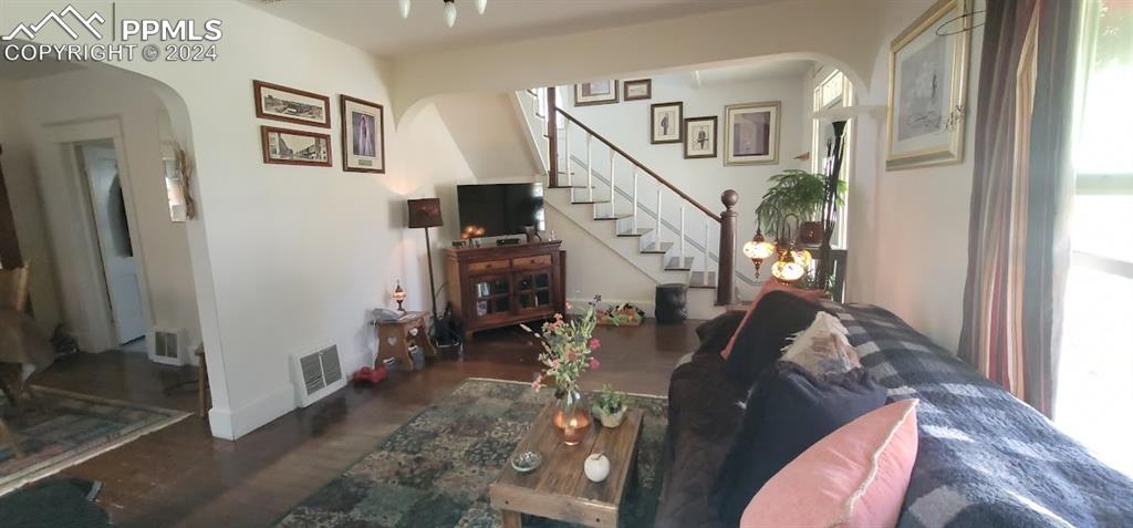 209 Indiana Avenue Walsenburg, CO 81089 - Photo 6 of 37 a living room with furniture and a clock