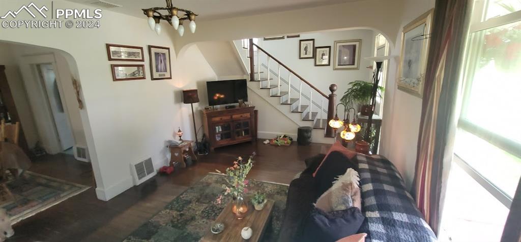 209 Indiana Avenue Walsenburg, CO 81089 - Photo 7 of 37 a living room with furniture and a flat screen tv