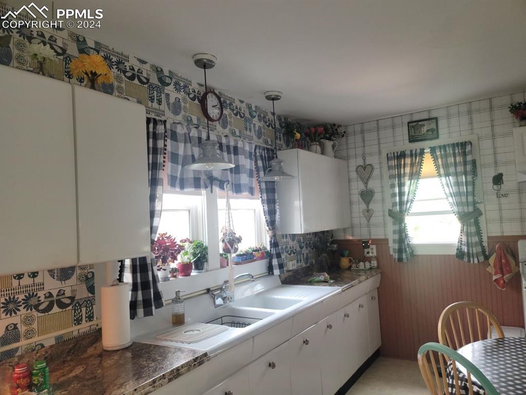 209 Indiana Avenue Walsenburg, CO 81089 - Photo 8 of 37 a kitchen with a refrigerator and a sink