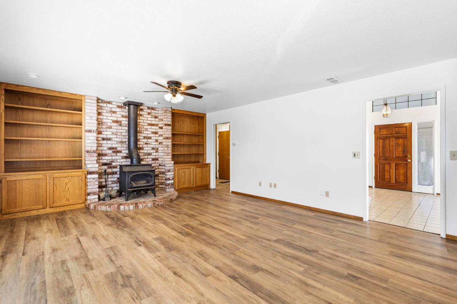 8711 Fruchtenicht Road Knights Landing, CA 95645 - Photo 15 of 44 a view of an empty room with a window and wooden floor