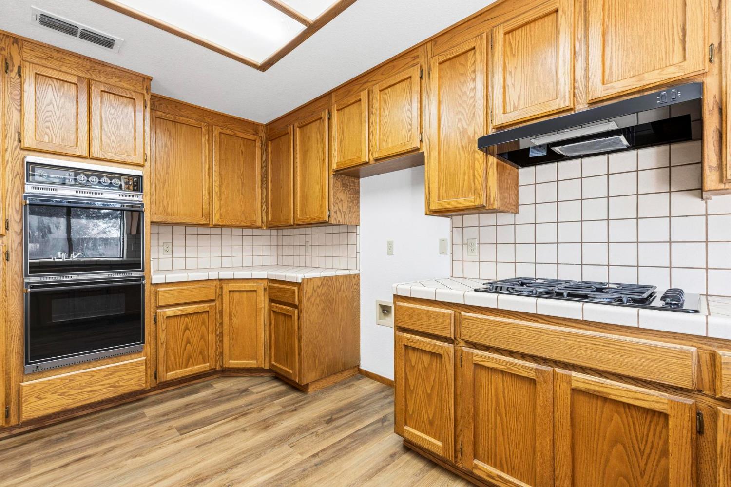8711 Fruchtenicht Road Knights Landing, CA 95645 - Photo 19 of 44 a kitchen with stainless steel appliances granite countertop a sink stove and cabinets