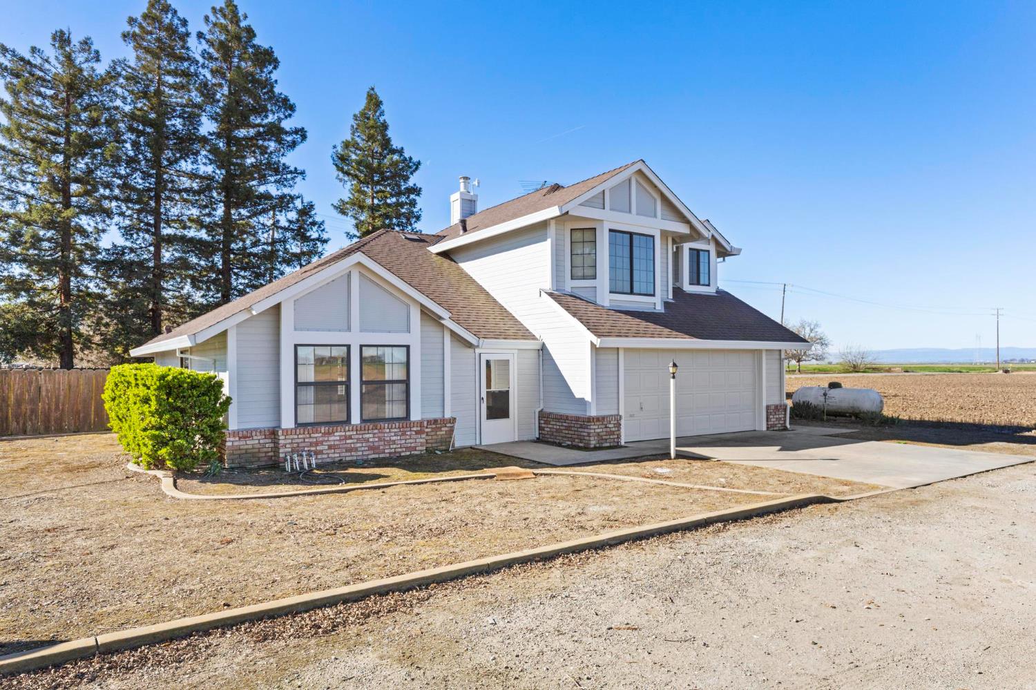 8711 Fruchtenicht Road Knights Landing, CA 95645 - Photo 3 of 44 a front view of a house with a yard