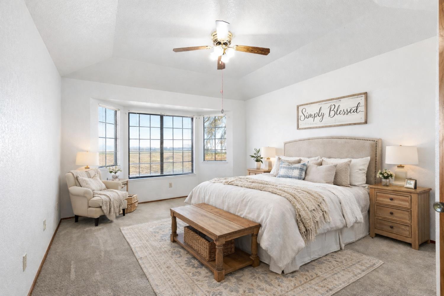 8711 Fruchtenicht Road Knights Landing, CA 95645 - Photo 33 of 44 a spacious bedroom with a bed and a chandelier