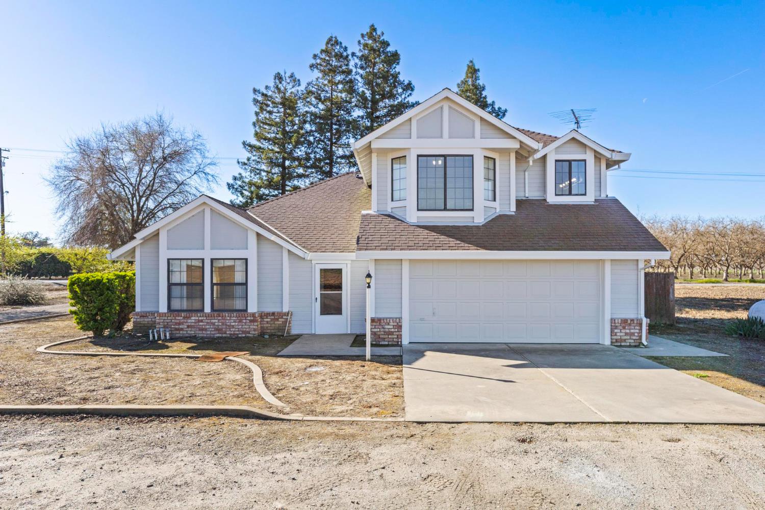8711 Fruchtenicht Road Knights Landing, CA 95645 - Photo 4 of 44 a front view of a house with a yard