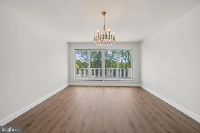 a kitchen with a refrigerator and a sink