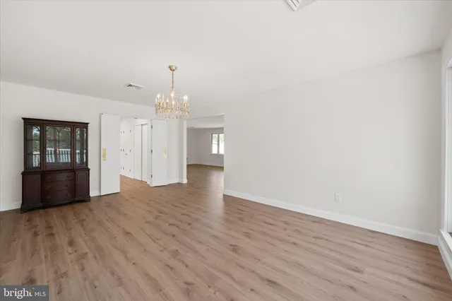 a kitchen with sink stove and cabinets